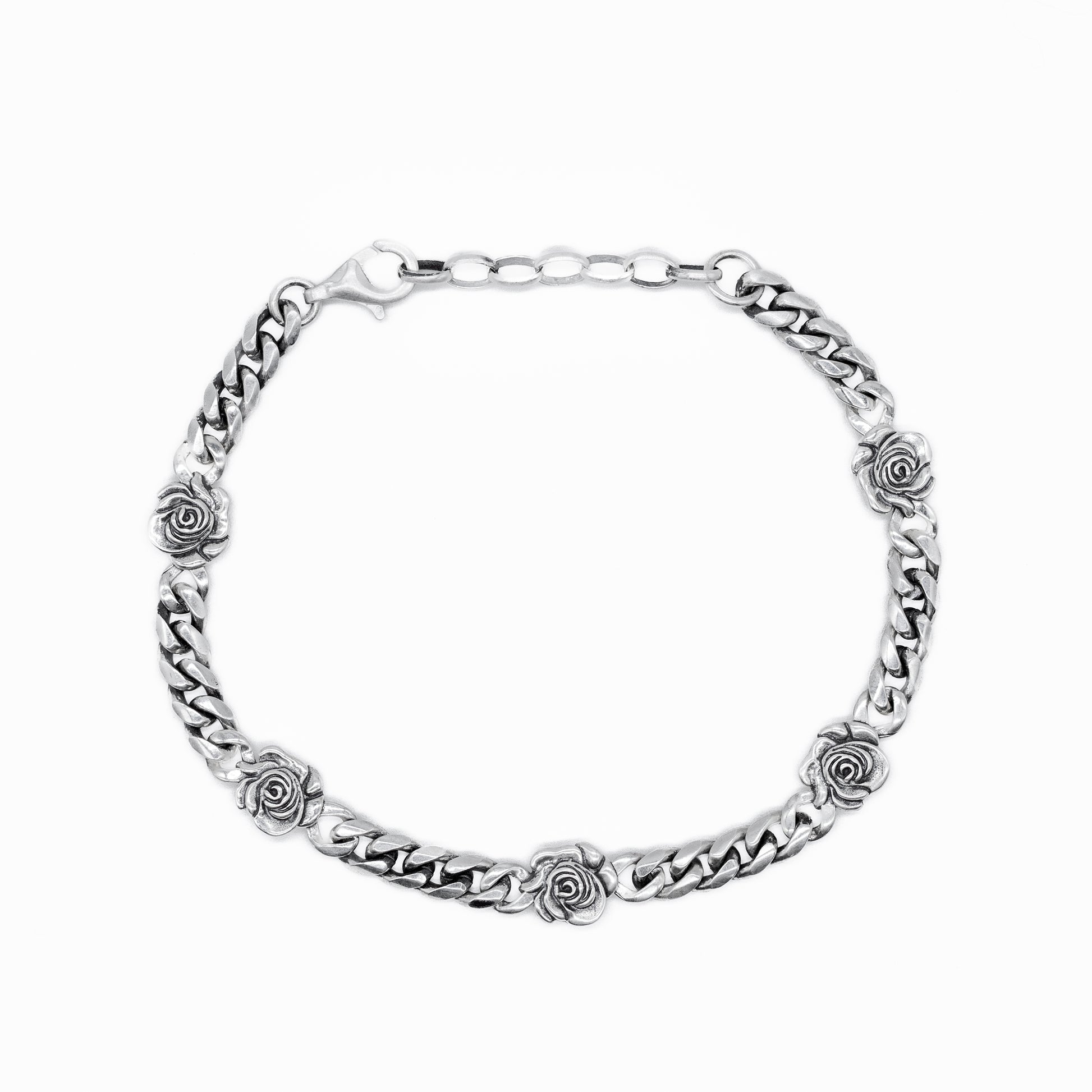 Silver curb bracelet with 5 silver roses dotted evenly throughout by Serge DeNimes