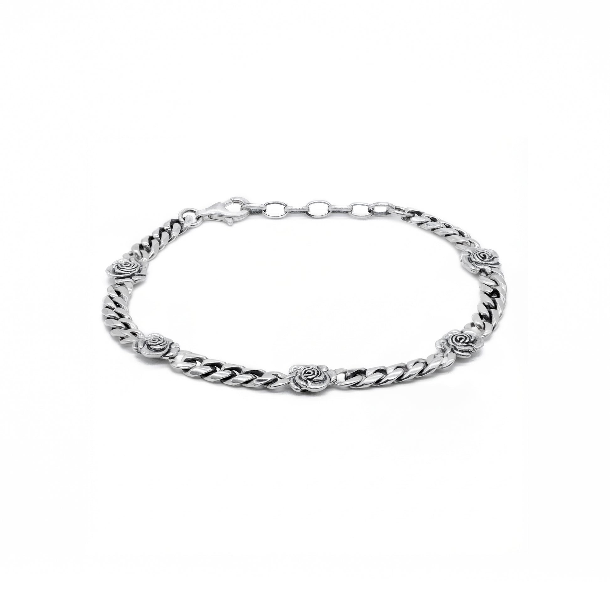 Silver curb bracelet with 5 silver roses dotted evenly throughout by Serge DeNimes