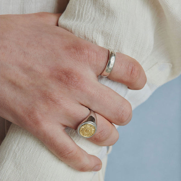 Model hand wearing the Traditional Hallmark Ring on his index finger