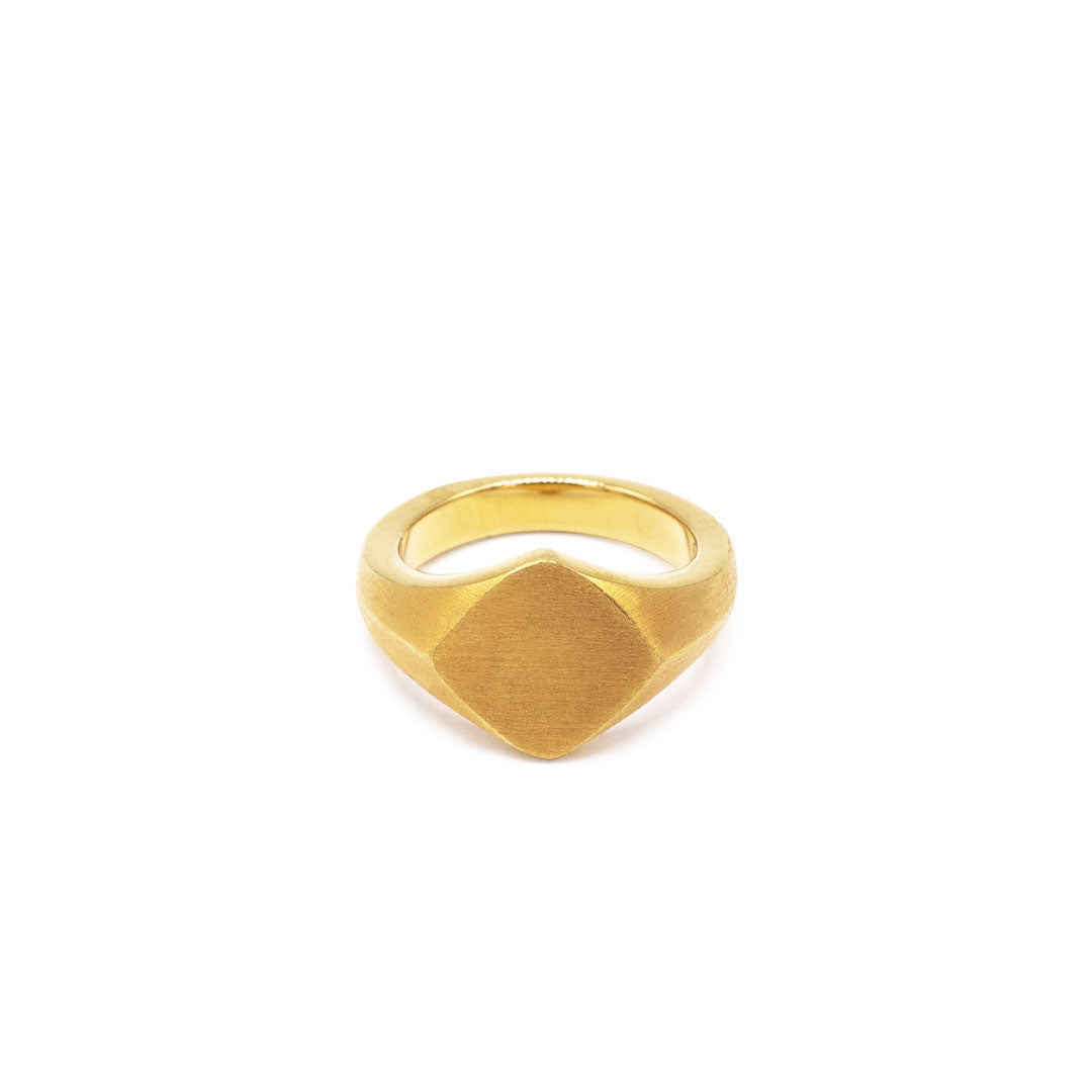 Gold plated Silver ring with Rhombus shaped face and heavily brushed finish on a white background