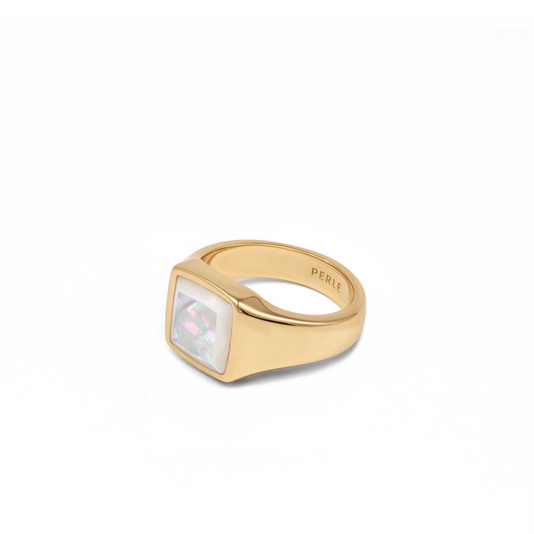 Gold plated Silver ring with Rhodium plating and large Mother of Pearl stone on a white background