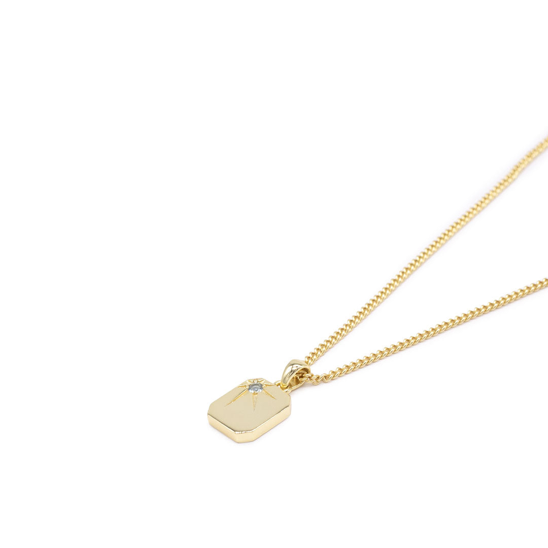 Gold plated Silver necklace with a rectangular pendant, oversized star setting and pale blue gemstone