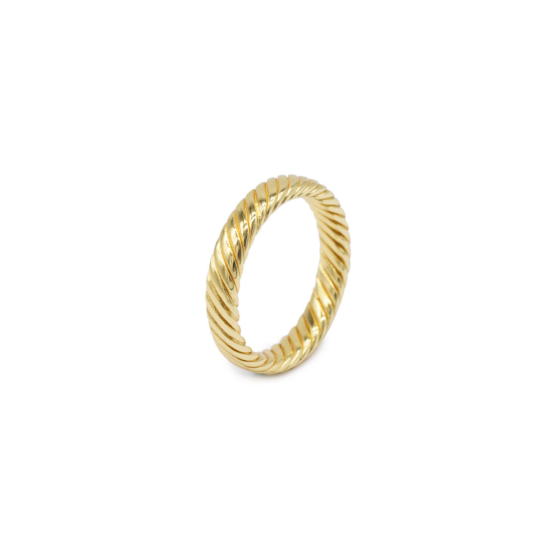 Gold plated Silver band ring with a twist detail on a white background by Serge DeNimes
