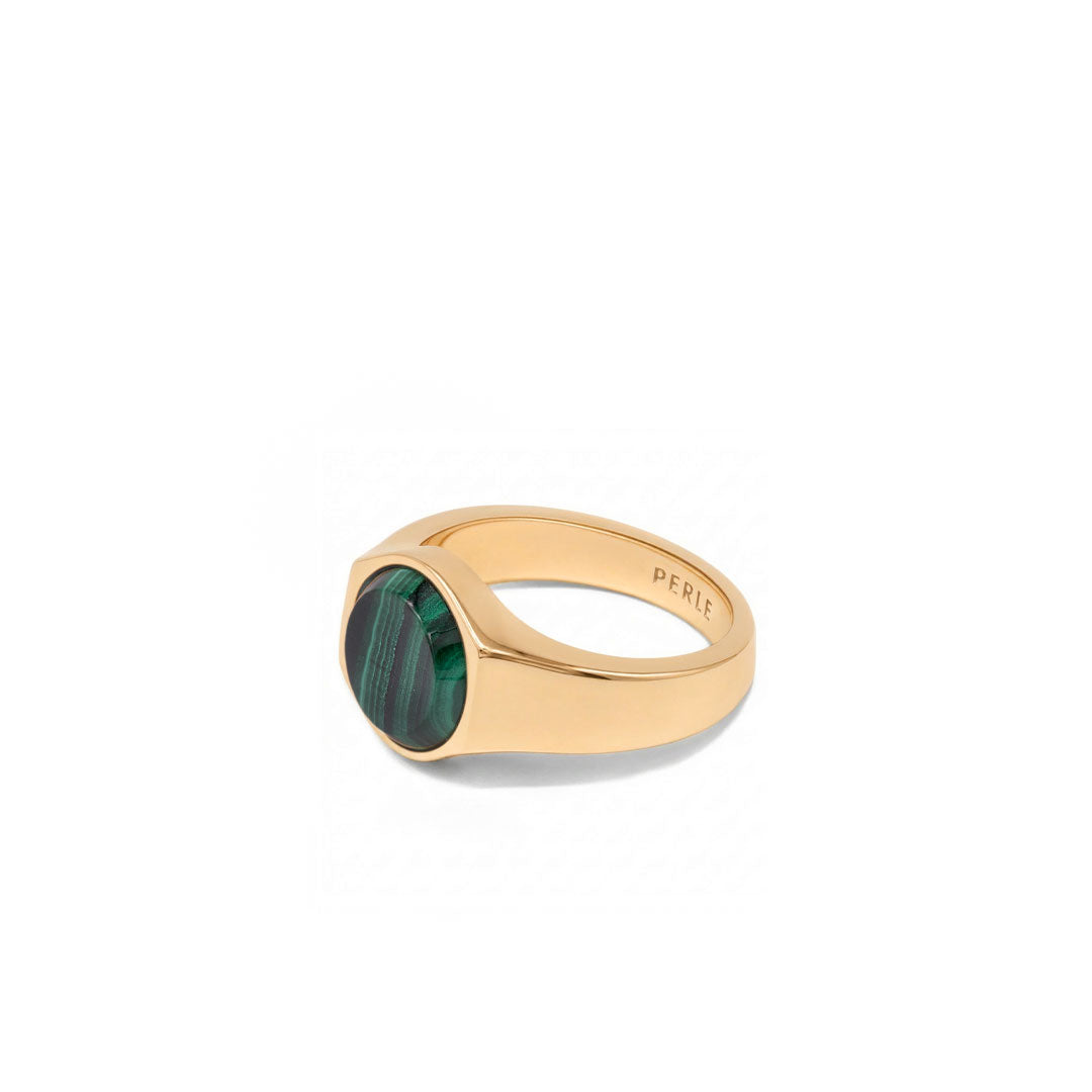 Gold plated Silver ring with Rhodium plating and large Malachite stone on a white background
