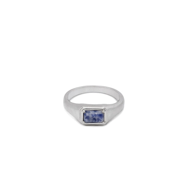 Silver ring with a blue Jasper gemstone on a white background