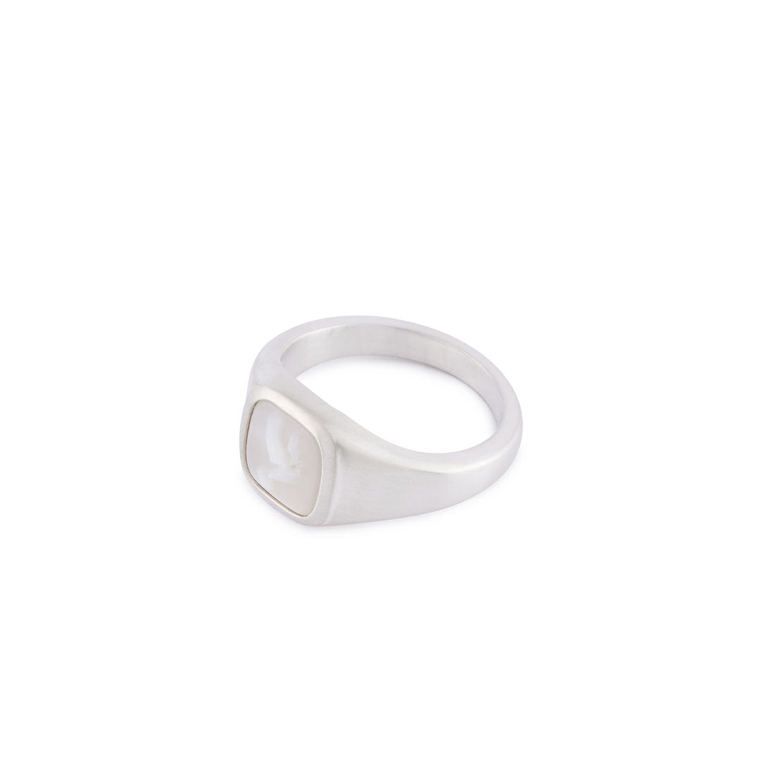 Silver Signet ring with a mother of pearl stone with dove cameo debossed, side view showing face detail