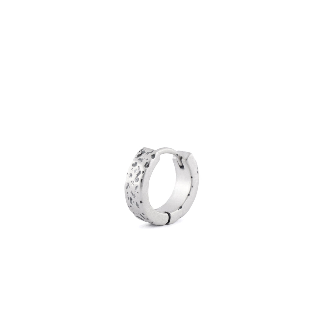 Sterling Silver huggie earring with rough texture in closed position
