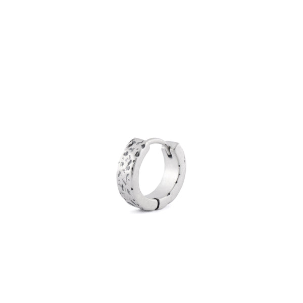 Sterling Silver huggie earring with rough texture in closed position