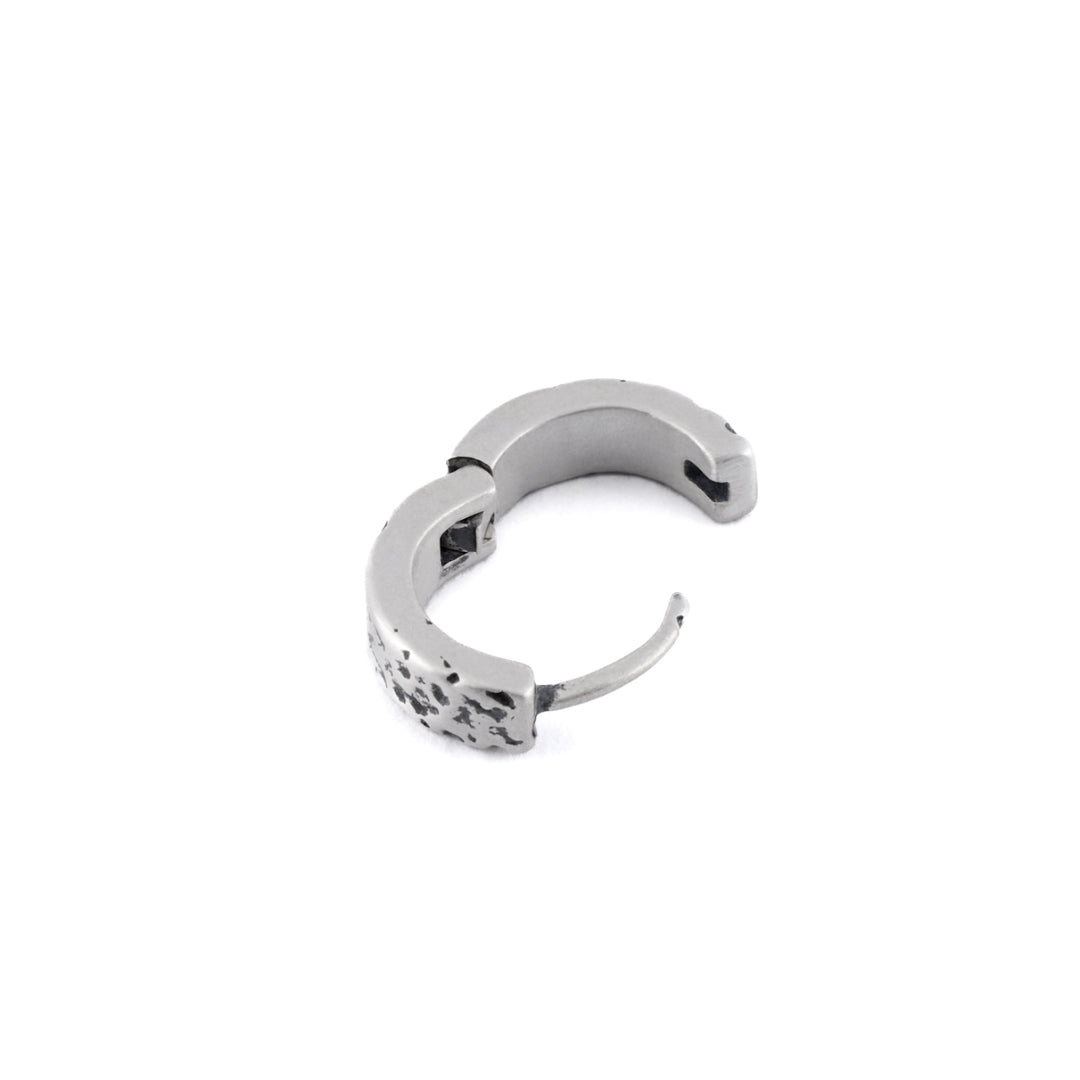 Sterling Silver huggie earring with rough texture in closed position