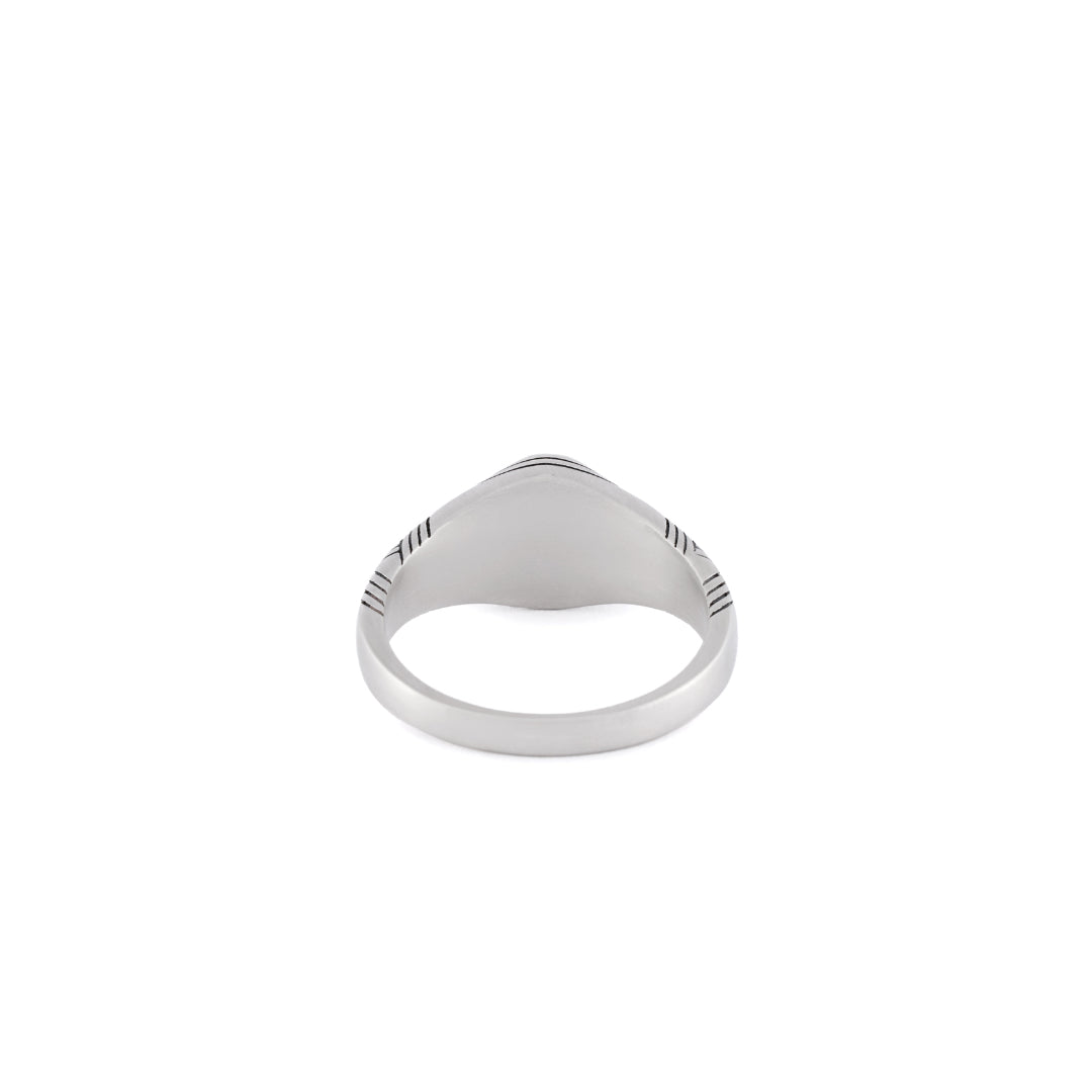 Back view of silver ring on white background