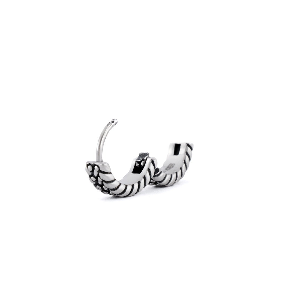 Silver huggie earring with keeper detailing on outside