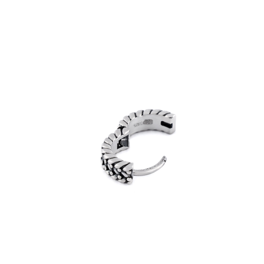 Silver huggie earring with keeper detailing on outside