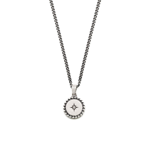 Silver necklace with slim curb chain and round pendant with diagonal border, star setting and clear gemstone - Serge DeNimes