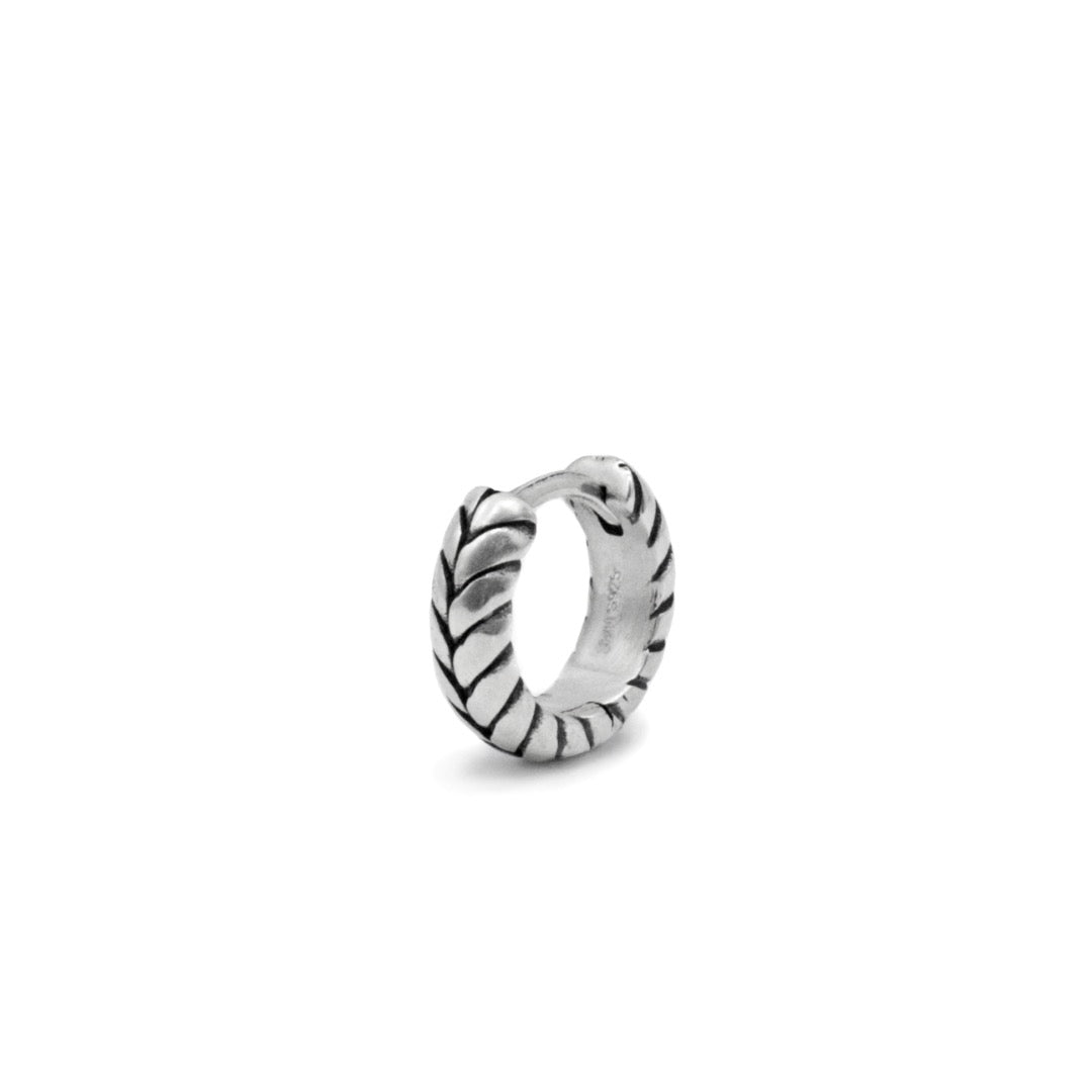 Silver huggie earring with overlap detailing
