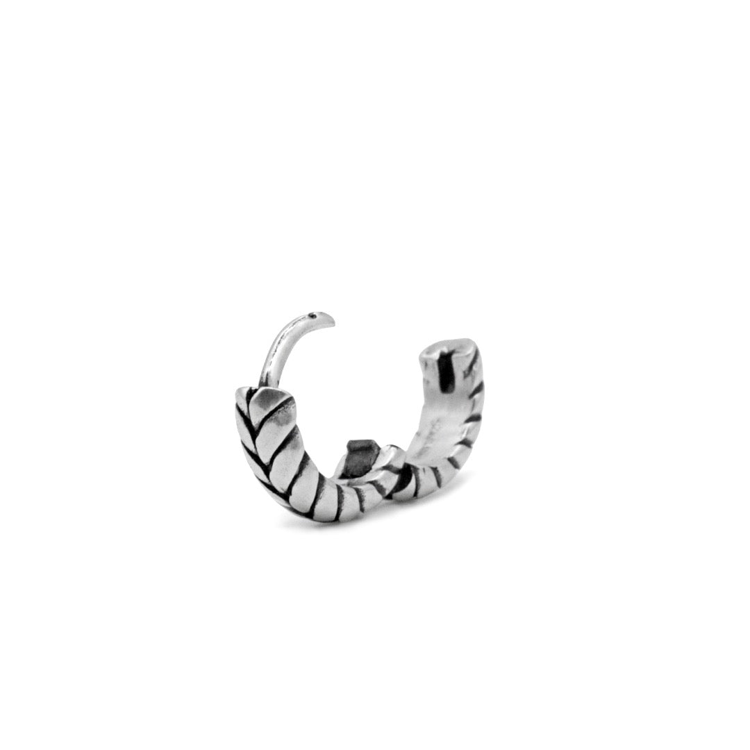 Silver huggie earring with overlap detailing