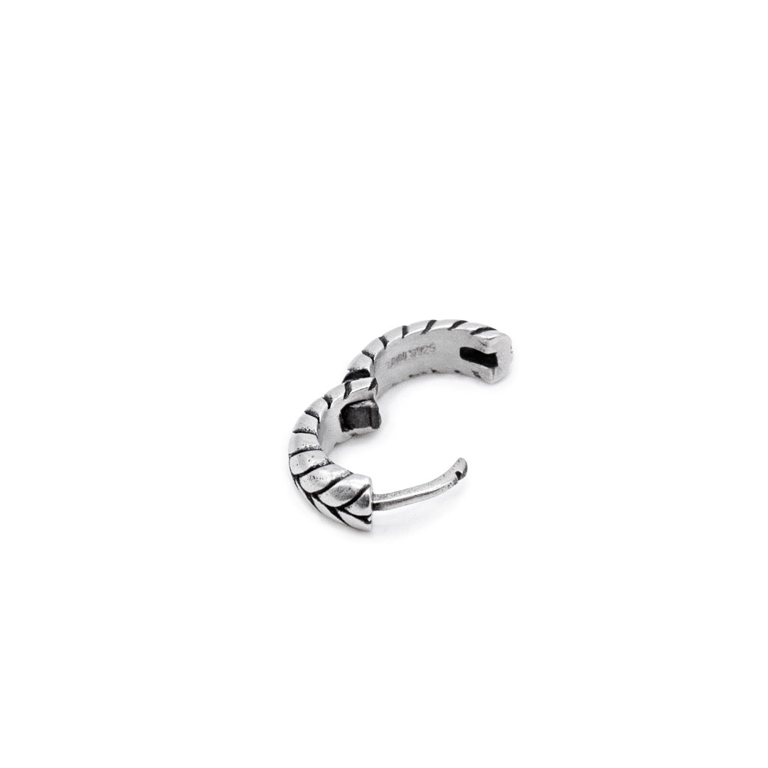 Silver huggie earring with overlap detailing