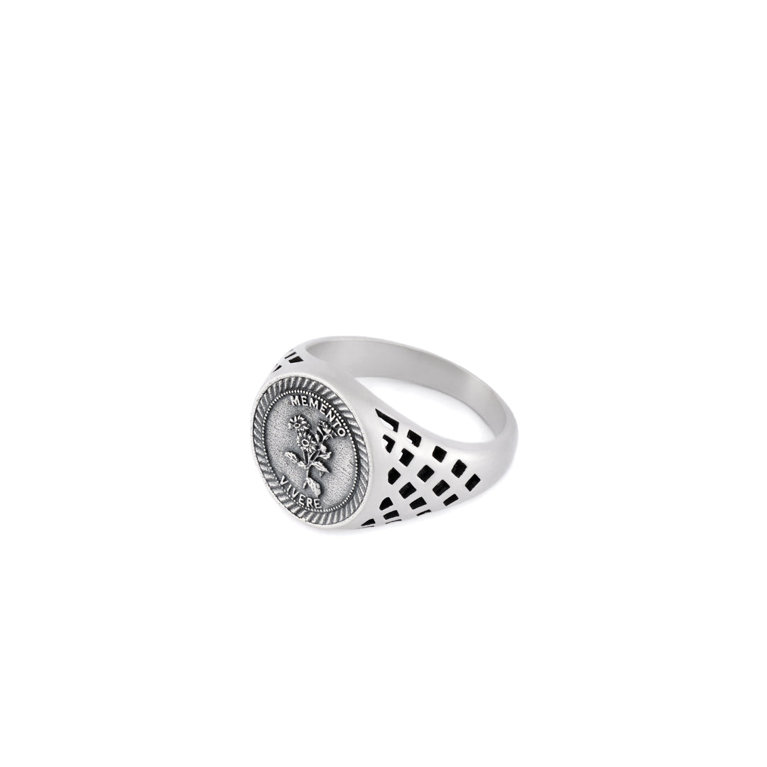 Silver Sovereign style ring with cut out detailing on the shoulders, dashed border around the face and flower motif with latin motto - Serge DeNimes
