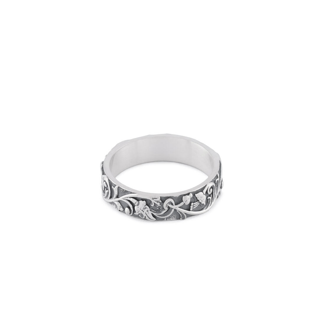 Silver band ring with floral motif all the way around and smooth inside - Serge DeNimes