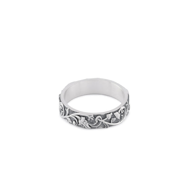 Silver band ring with floral motif all the way around and smooth inside - Serge DeNimes