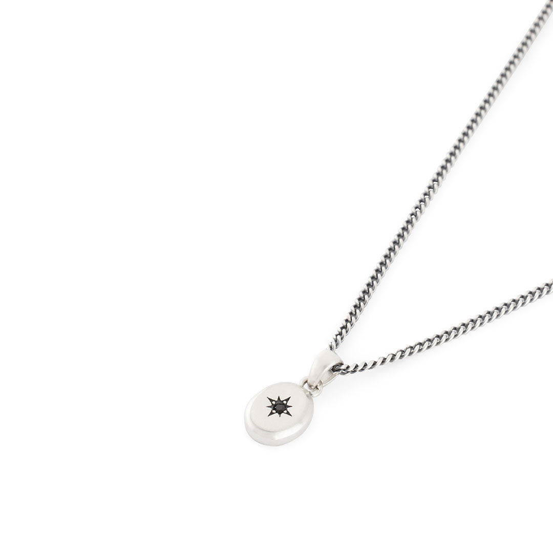 Silver curb chain with oval pendant with star setting and black gemstone - Serge DeNimes