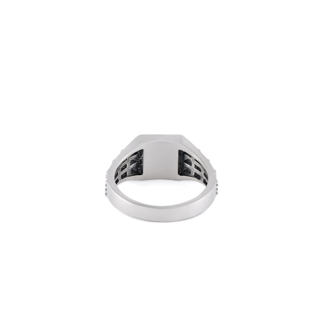 Silver ring with small square face and a cut out stud and grid effect on the shoulders back view - Serge DeNimes
