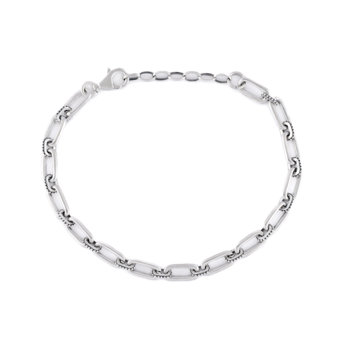 Silver bracelet with alternating long oval links and smaller dotted links - Serge DeNimes