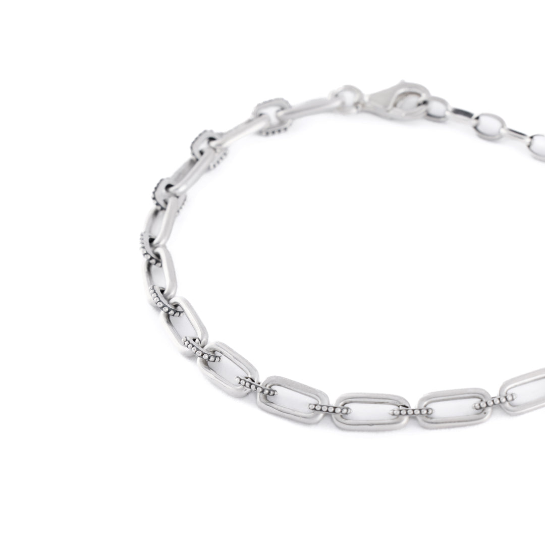 Silver bracelet with alternating long oval links and smaller dotted links - Serge DeNimes