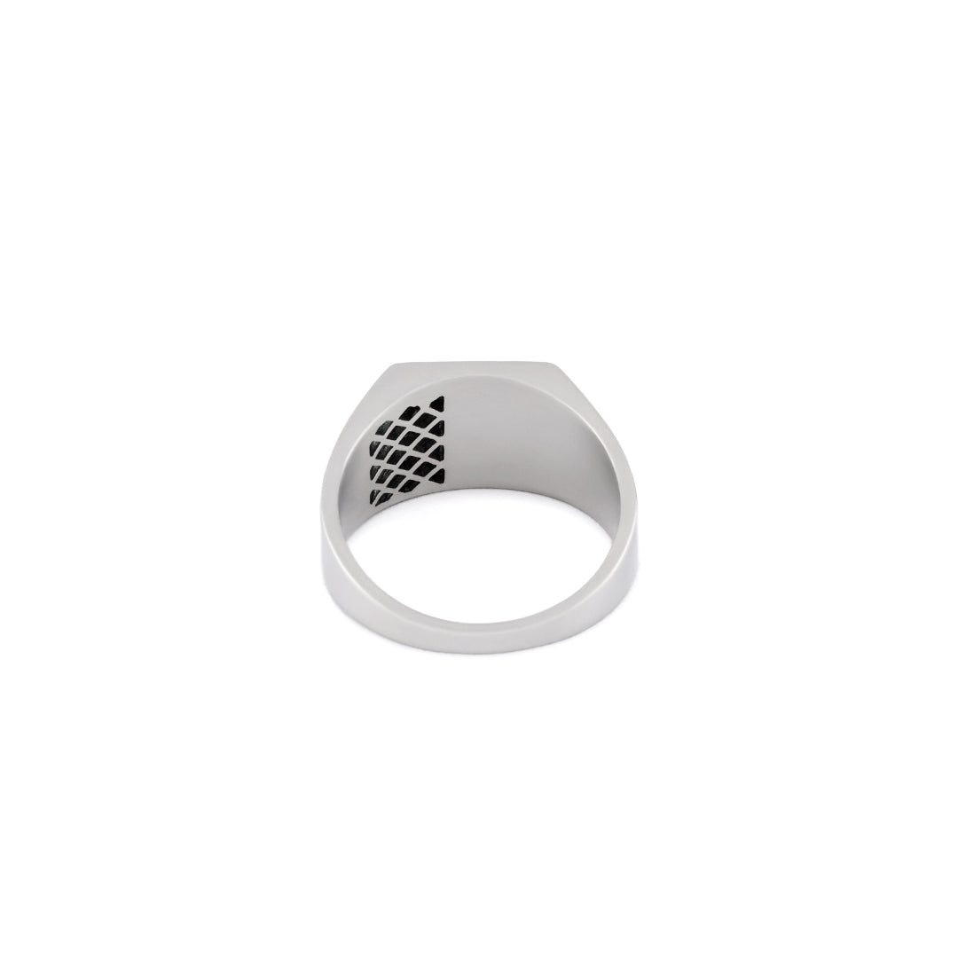 Silver ring with a chunky square face has cut out grid detailing on one side back view  - Serge DeNimes