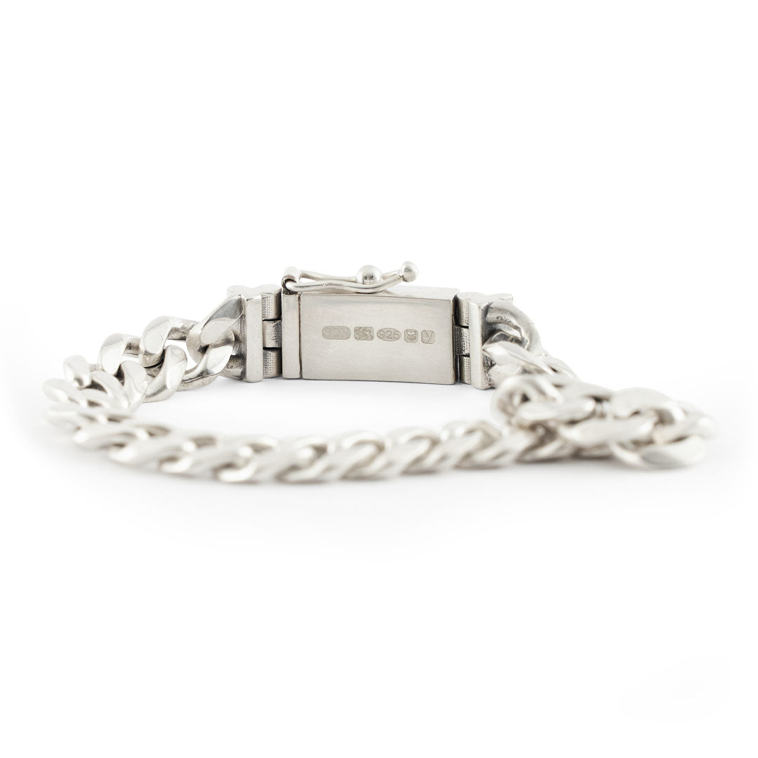 Extra chunky 10mm Silver curb bracelet with box clasp with large hallmarks on white background