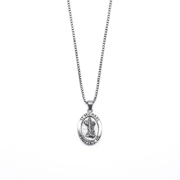 Silver necklace with an oval shaped pendant with a depiction of St Michael