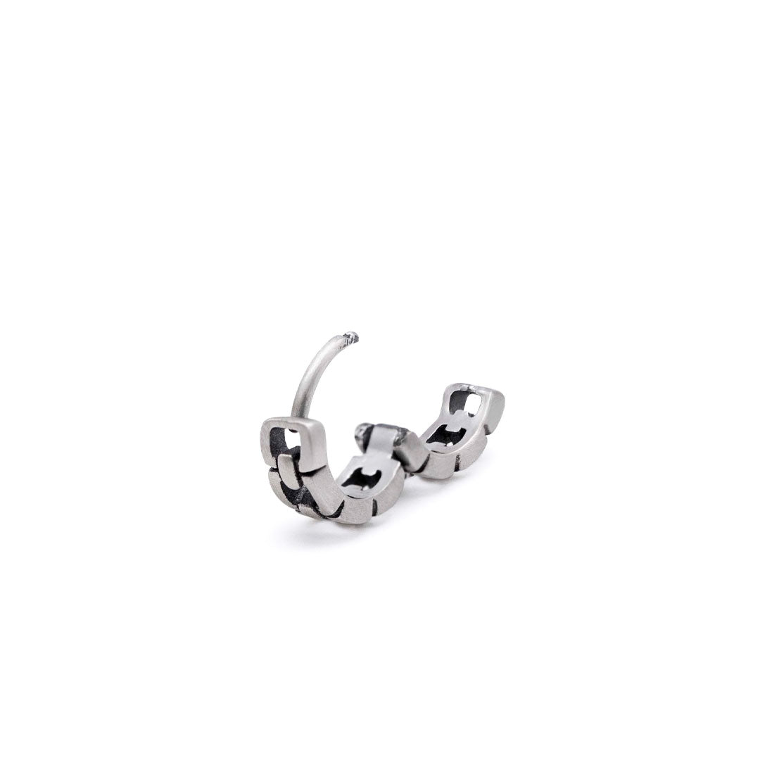 Sterling Silver huggie earring with a square cut out design in an open position by Serge DeNimes