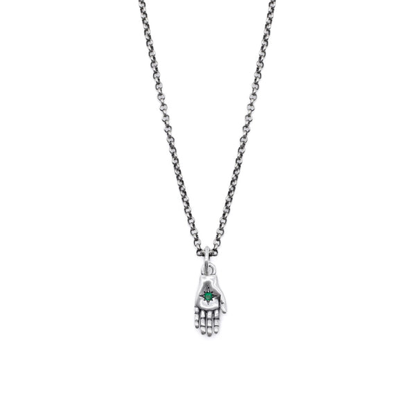 Silver hand-shaped pendant necklace with a green gemstone on a white background