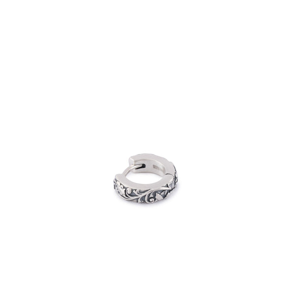 Silver hoop earring in a closed position with ornate floral detailing - Serge DeNimes