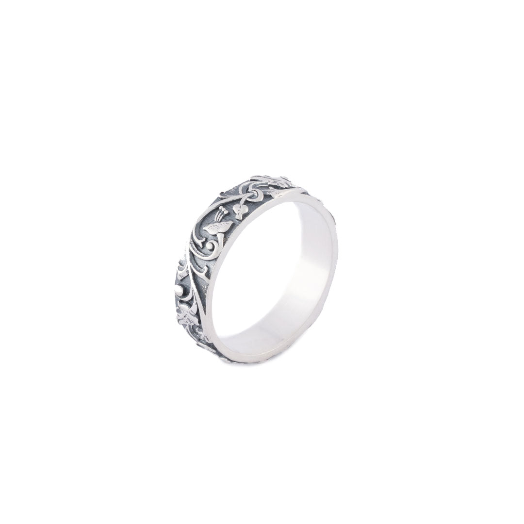 Silver band ring with floral motif all the way around and smooth inside - Serge DeNimes