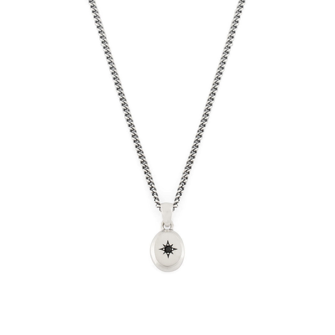 Silver curb chain with oval pendant with star setting and black gemstone - Serge DeNimes