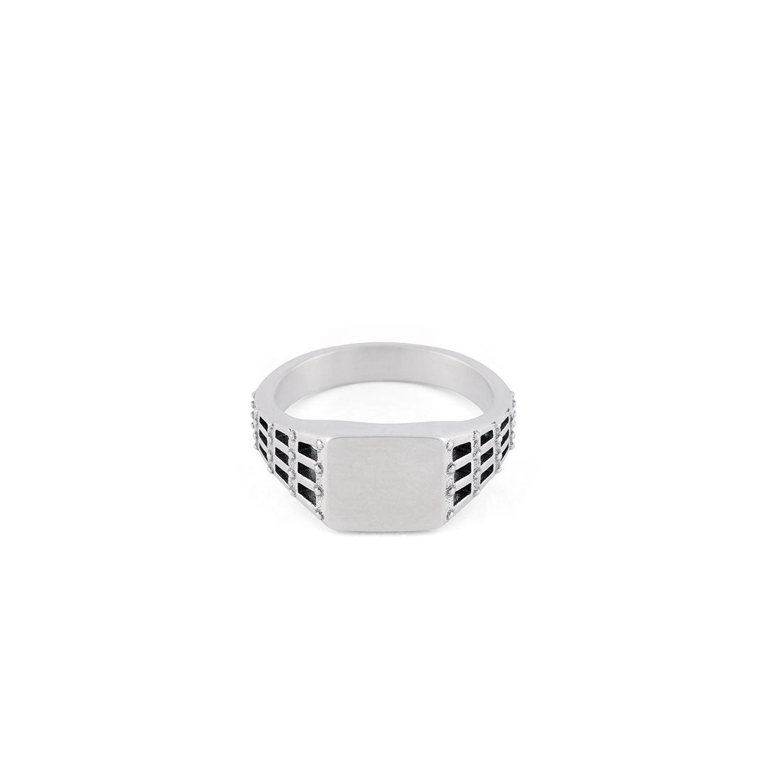 Silver ring with small square face and a cut out stud and grid effect on the shoulders - Serge DeNimes