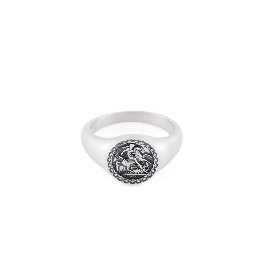 Silver Sovereign style ring with cut out detailing on the shoulders, dashed border around the face and flower motif with latin motto - Serge DeNimes