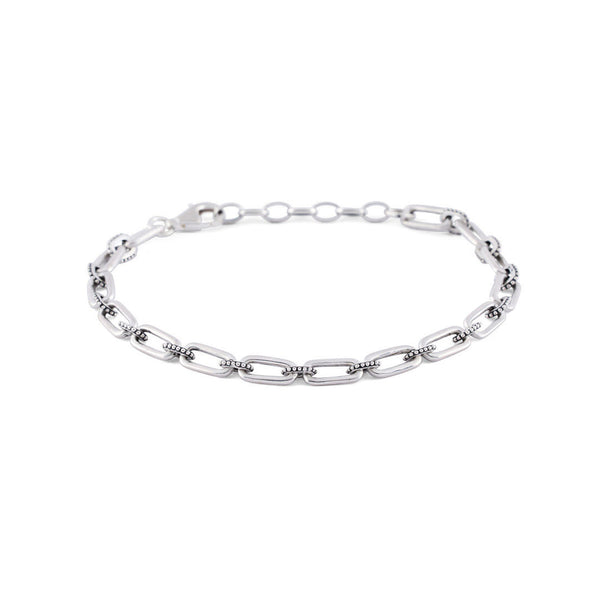Silver bracelet with alternating long oval links and smaller dotted links - Serge DeNimes