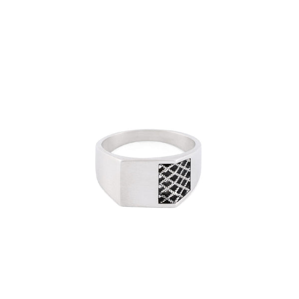 Silver ring with a chunky square face has cut out grid detailing on one side - Serge DeNimes