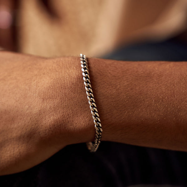 Model wrist wearing Sterling Silver 5mm Curb Chain Bracelet - Serge DeNimes